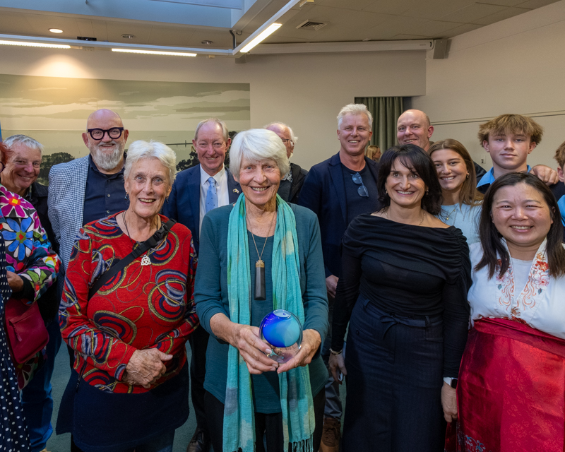 Penny Molnar (centre front) celebrates with family and friends.