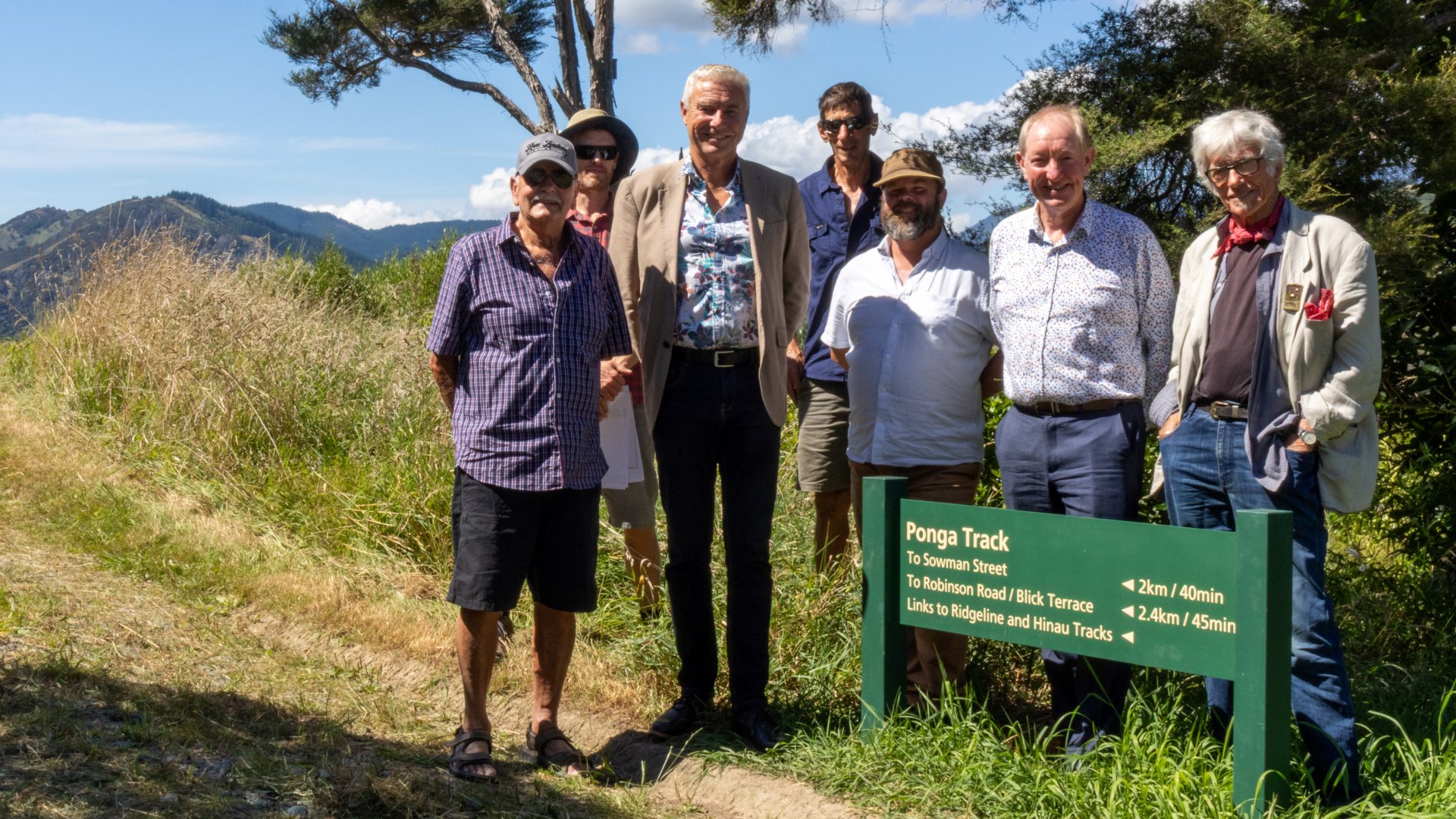 Mayor Nick Smith at start of Ponga Track with other people from Council