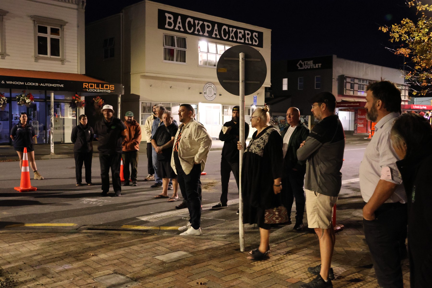 People attend the dawn ceremony on Bridge Street