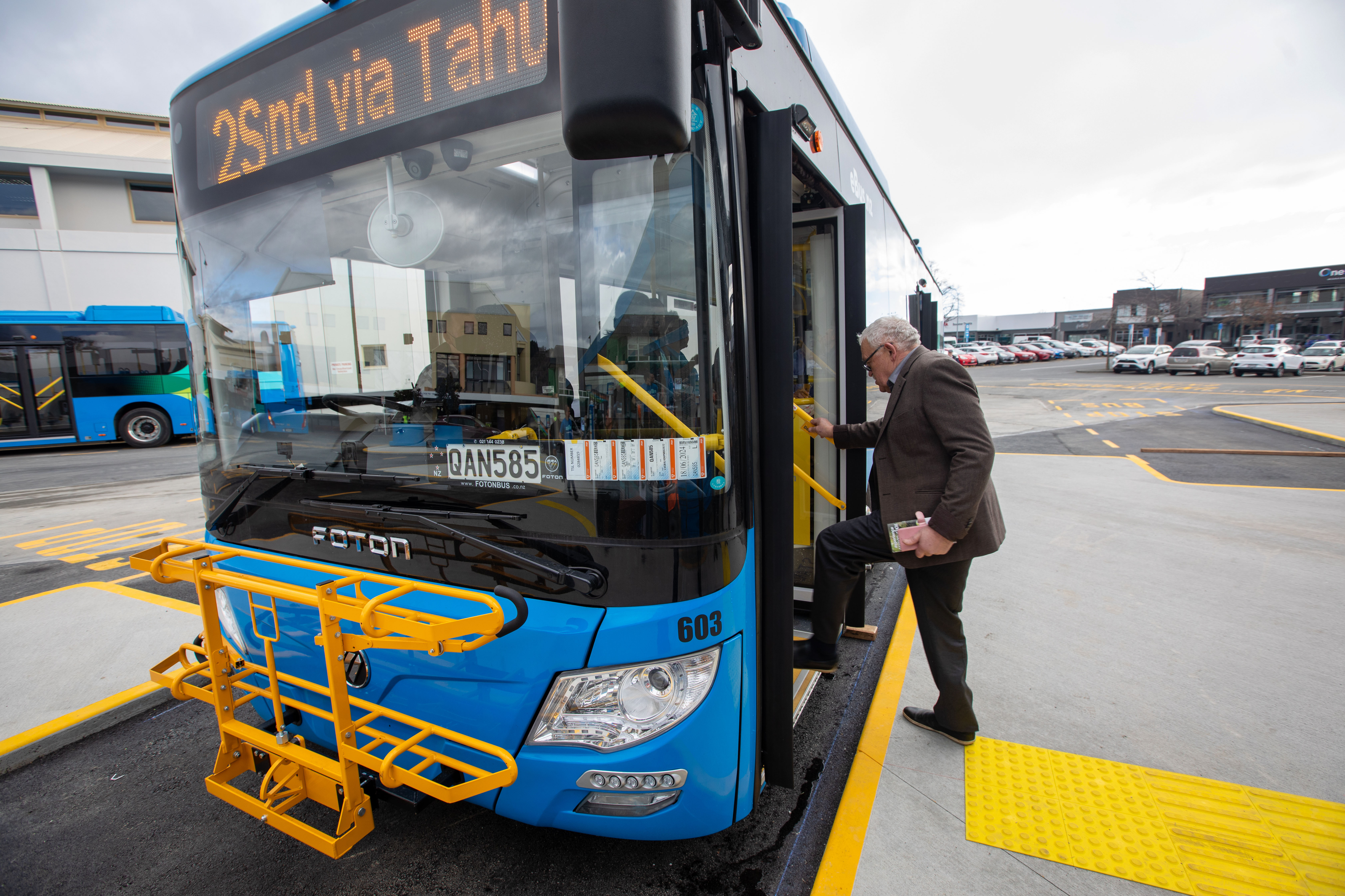 A man gets on board the eBus
